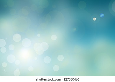 A Soft Light Blue Bokeh Abstract  Background With Small Light Flares