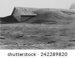 Soil drifting over a farm building on a South Dakota farm in 1935. Dakota was north of the 