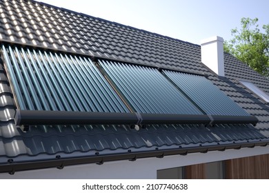 Solar panels, heater collectors on the roof, 3D illustration 