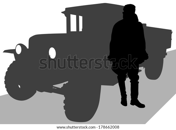 Soldier at old military\
truck