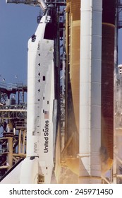 Space Shuttle Challenger Disaster. Grey-brown Smoke On The Right Side Of The Solid Rocket Booster, Line Directly Across From The Letter 'U' In United States. Jan. 28, 1986.