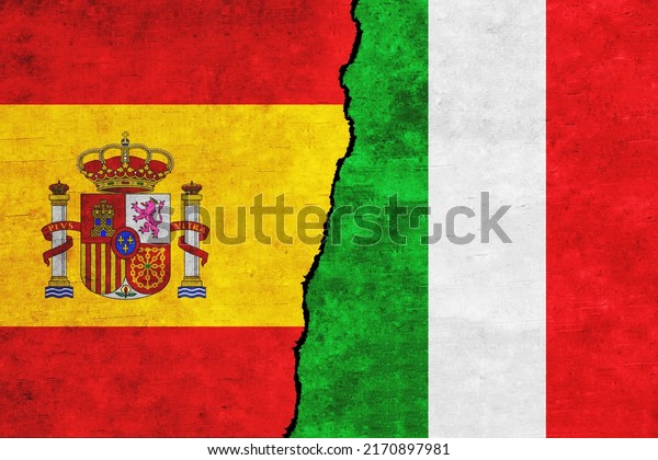 Spain and Italy\
painted flags on a wall with a crack. Italy and Spain relations.\
Spain and Italy flags\
together