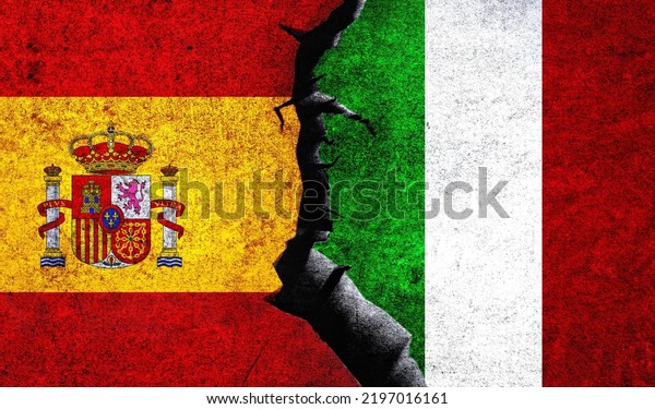 Spain vs Italy flags on a wall with a crack.\
Spain Italy relations. Italy Spain conflict, war crisis, economy,\
relationship, trade\
concept