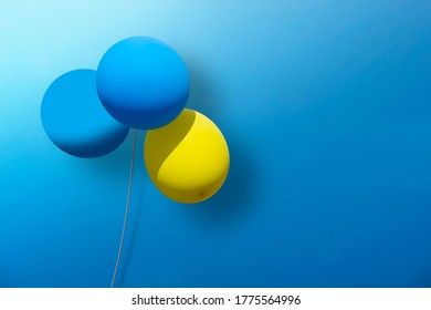 Sparse 3d Design With Blue And Yellow Baloons On Blue Background.   Copy Space, Can Be Used As Greeting Card. Illustration.