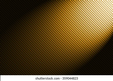 Spotlight On Yellow Carbon Fiber Background.