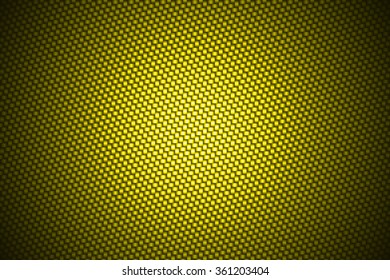 Spotlight On Yellow Carbon Fiber Background.