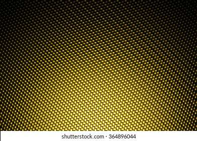 Spotlight On Yellow Carbon Fiber Background.