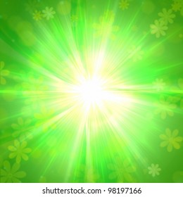 spring flowers and sun rays over green background