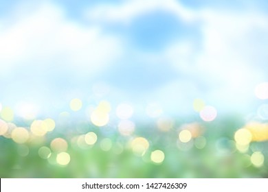 Spring Summer Nature Landscape Blurred Background.Green Grass Blue Sky Texture.Abstract Easter Defocused Backdrop.