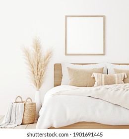 Square Frame Mockup In Boho Bedroom Interior With Wooden Bed, Beige Blanket, Pillow With Tassels, Dried Pampas Grass And Basket On White Wall Background. 3d Rendering, 3d Illustration