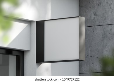 Square Light Box With Company Name On Concrete Building Wall. Concept Of Advertising And Marketing. 3d Rendering Mock Up