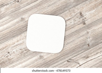 Square Paper Coaster. Isolated On Wood Background. 3d Render