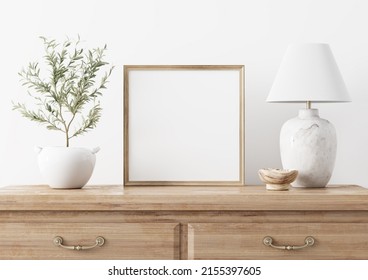 Square wooden frame mockup in traditional living room interior with classic chest of drawers, marble lamp and small olive tree on white wall background. Illustration, 3d rendering