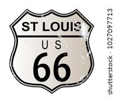 St Louis Route 66 traffic sign over a white background and the legend ROUTE US 66