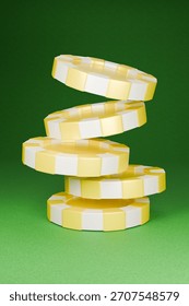The stack of casino chips is twisting and potentially toppling over. 3D Illustration