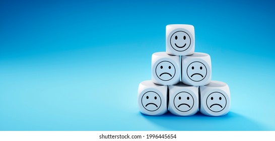 Stack of Dice with happy and sad face icons - 3D illustration - Shutterstock ID 1996445654