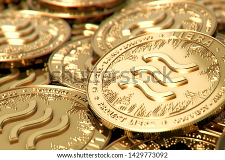 Stack of golden Libra cryptocurrency concept coins in blurry closeup. 3D rendering