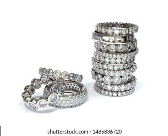 Stack Of Multiple Eternity Diamond Rings, Various Settings, On White Background. 3D Illustration