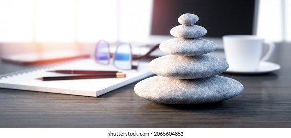 Stack of stones on a desktop workplace - 3D illustration