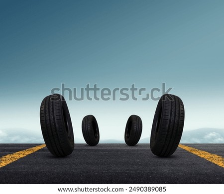Stack of Tires on an Empty Road with Blue Sky Background