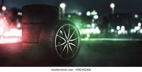 Stacks Of Car Tires On A Street At Night