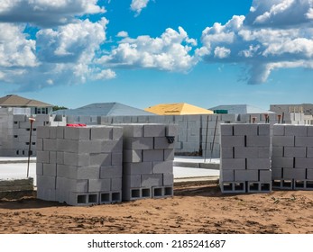 Stacks Of Concrete Blocks By Foundation For A Single-family House To Be Built In A Suburban Development In Florida, For Motifs Of Supply And Demand. Light Digital Oil-painting Effect, 3D Rendering.