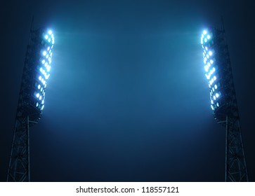 Stadium Lights Against Dark Night Sky With Copy Space