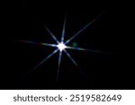 Star shaped lens flare on black background.