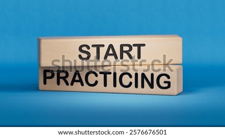 Start Practicing symbol. Concept word Start Practicing on wooden blocks.Business and Start Practicing concept. Copy space.3D rendering on blue background.
