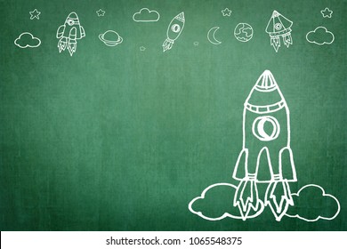 Startup rocket for business start-up project, entrepreneur innovation concept with creative launching spaceship imagination doodle motivation drawing on office or school class teacher's chalkboard - Powered by Shutterstock