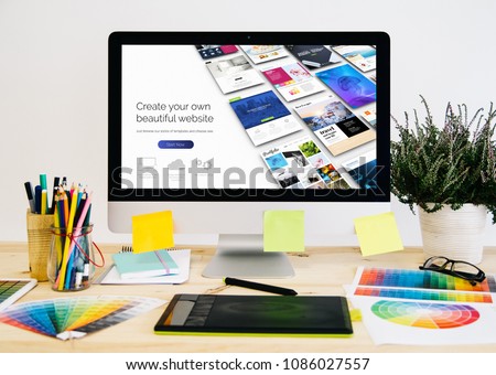  Stationery desktop with design stuff, computer and graphic tablet. website builder design.