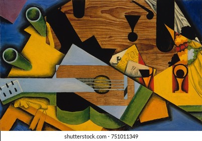 STILL LIFE WITH A GUITAR, by Juan Gris, 1913, Spanish Cubist painting, oil on canvas. This work is strongly influenced by the Picasso/Braque second style, Synthetic Cubism as Gris named it. Flat forms