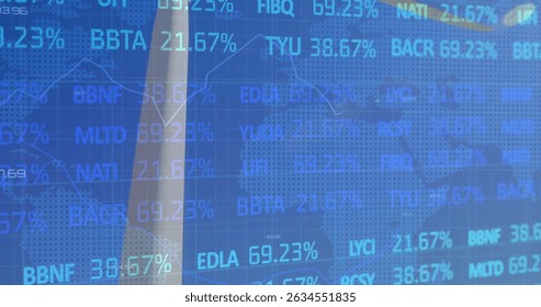 Stock market data processing over rear view of male engineer taking picture of the windmill. Global economy and renewable energy technology concept