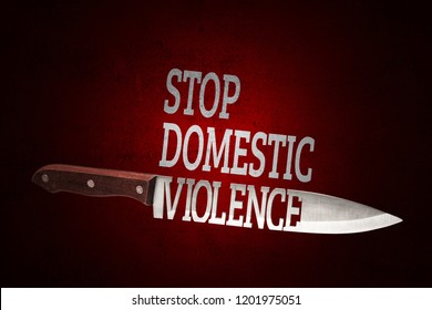 Stop domestic violence. Kitchen knife on red shabby background.