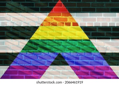 Straight Ally Flag Projected On A Sunny Brick Wall Background