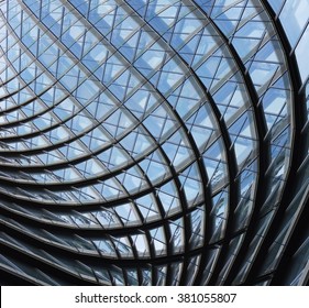 Structural Glass Facade Of Fantastic Office Building. Contemporary Architectural Fiction. Glazed Aluminum Structure. Abstract Architecture Fragment.