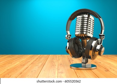 Studio microphone and professional headphones on wood table - Powered by Shutterstock