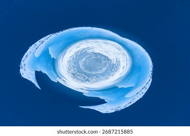 A stunning abstract image featuring a "tiny planet" or "little planet" effect of an icy landscape or glacier.