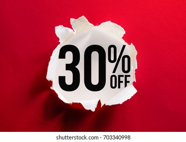 Stunning real red hot Paper ripped, torn show off discount 30% off inside background. Sale promotion concept for your unique selling promotion ad campaigns ; poster, banner, flyer, advertising layout - Powered by Shutterstock