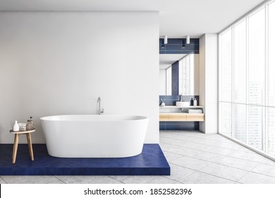 Stylish Blue And White Bathroom, Big White Bathtub And Two Sinks On The Background With Big Mirror. Illustration Of Modern New Furniture In Bathroom, 3D Rendering No People