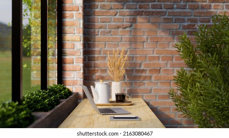 Stylish Coffee Shop Seating Area Near The Window With Laptop Computer, Coffee Cup, Kettle, Indoor Plants And Decor On Wooden Table Over Red Brick Wall. Rear View. 3d Rendering, 3d Illustration