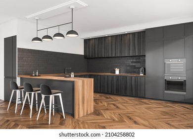 Stylish cooking interior with three bar chairs and wooden table, stove and oven with kitchenware, side view. Modern kitchen with minimalist furniture, 3D rendering