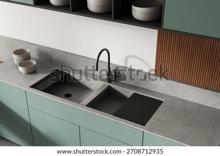 Stylish kitchen interior featuring modern sink design, pastel green cabinets, stone-like countertop, and wood panel wall accent. 3D Rendering