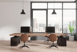 Stylish Office Interior With Pc Computers On Desks And Brown Chairs, Hardwood Floor. Stylish Workplace With Panoramic Window On Kuala Lumpur Skyscrapers. 3D Rendering