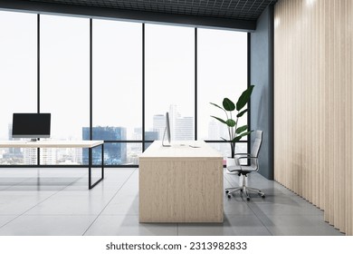 Stylish workspace table side view in coworking office with modern computers, city skyline view background from big window and green plant on glossy concrete floor. 3D rendering