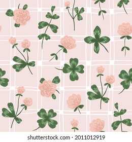 Stylized clover seamless pattern on pink checked backgrounf. Linum Flax Clover wildflowers. Celtic fabric blooming realistic isolated flowers. Vintage floral repeated background for tablecloth. 