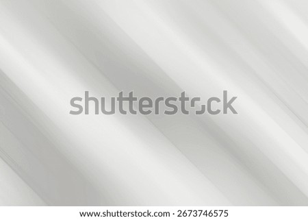 A subtle, abstract background featuring soft, diagonal light streaks and shadows on a textured, light gray surface, creating a gentle, serene atmosphere.