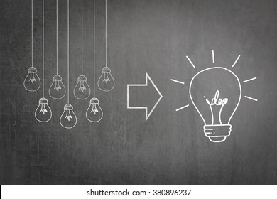 Successful team work brainstorm concept of strategic planning and synergy collaboration of good teamwork leader with big creative idea lightbulb thought on business chalkboard or teacher's blackboard