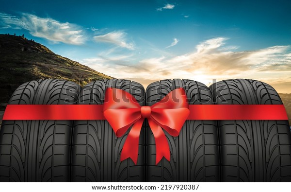 Summer car tires with gift ribbon on over blue sky\
with clouds. Car tyre protector close up. Black rubber tire. Brand\
new car tires. Close up black tyre profile. Car tires in a row. 3d\
render