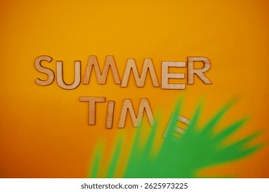 summer time write on orange background 
